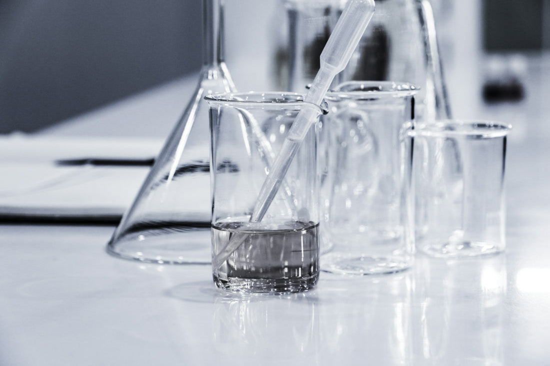 Generic image of lab equipment, including a pipette and beakers