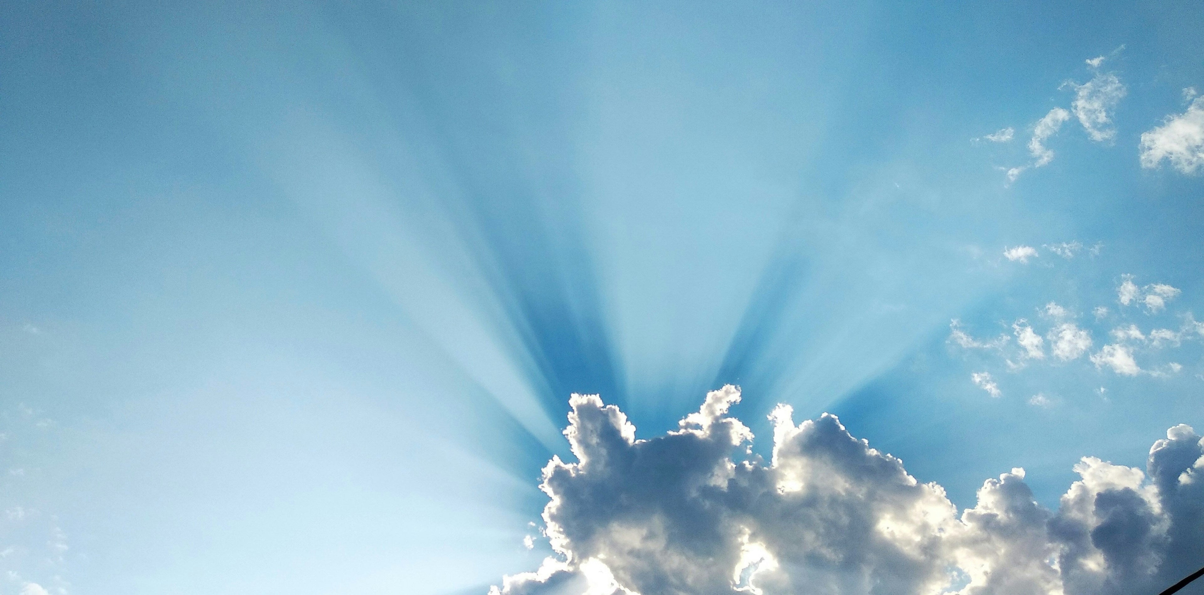 Sun rays scattering around a cloud