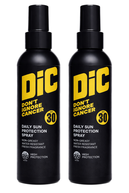 Two black spray sunscreen bottles with yellow and white text and DIC branding
